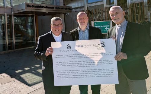 Father David Stewart (right) and Andrew Smith from Justice and Peace Scotland, along with the Moderator (left) outside the Scottish Parliament